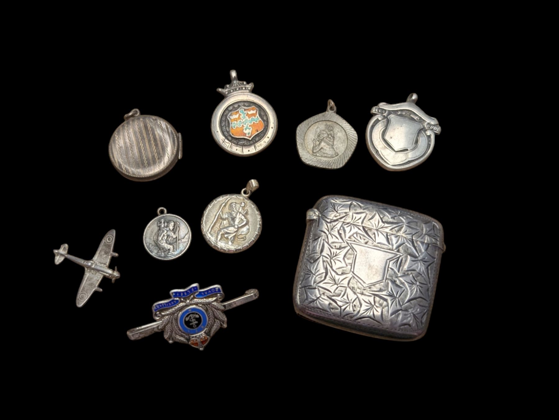 Silver vesta case, silver fobs and St Christopher pendants etc