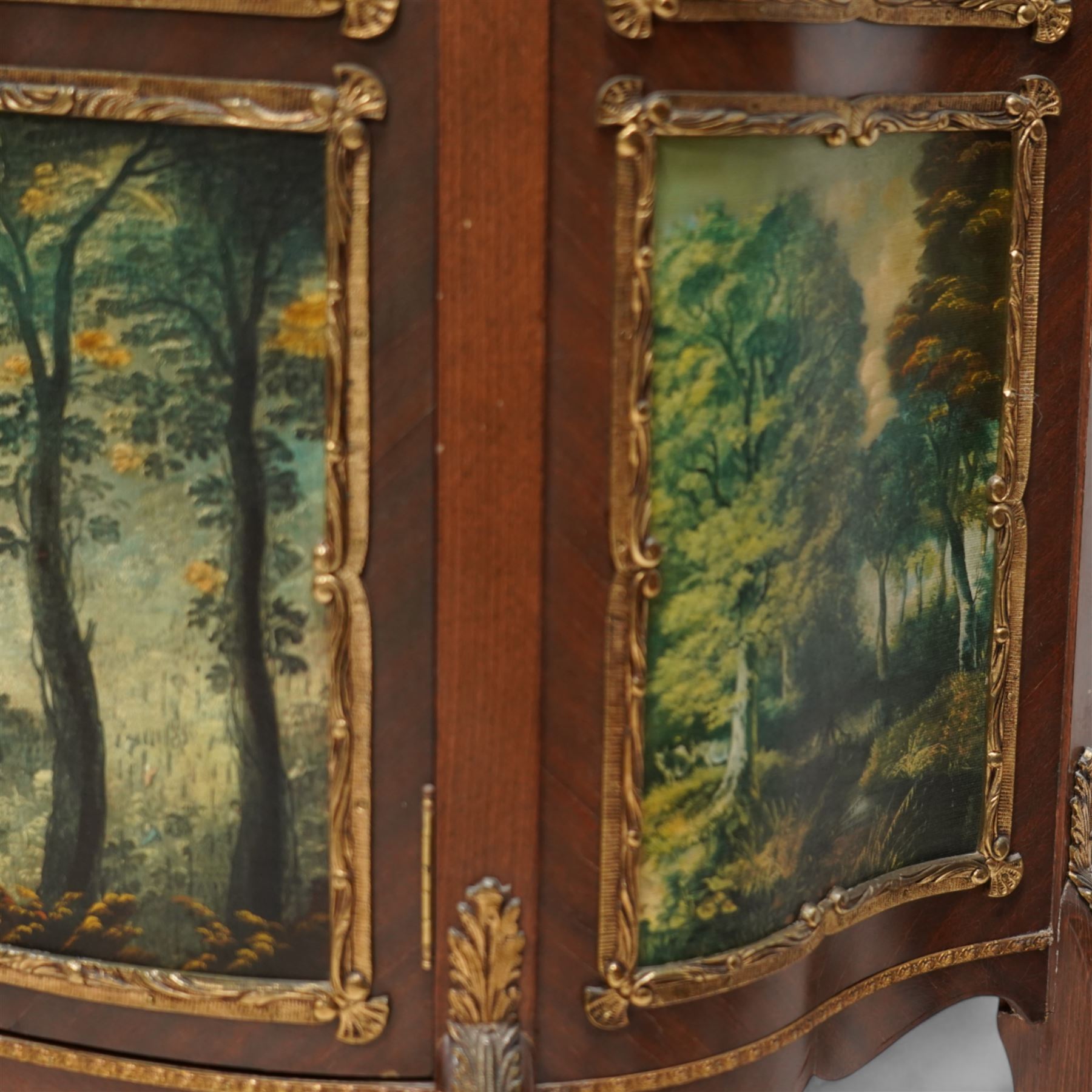 Mid-20th century rosewood vitrine display cabinet, shaped form with cast gilt metal gallery and mounts, enclosed by glazed door with Vernis Martin design panel, fabric lined interior with two glass shelves, on cabriole supports with cast acanthus leaf mounts 