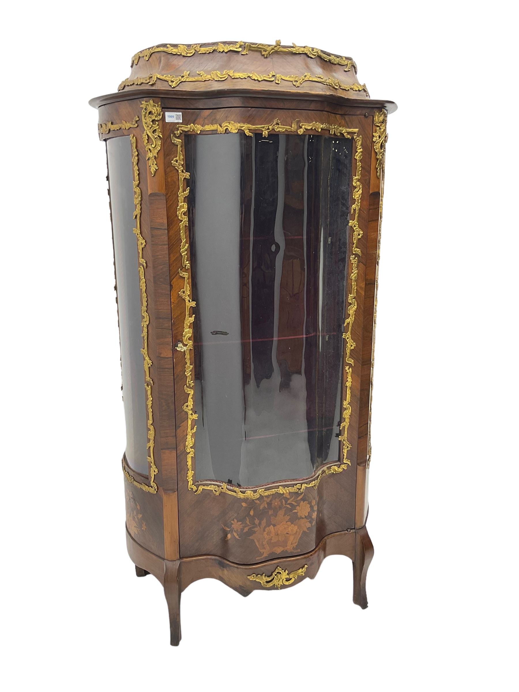 Early 20th century French kingwood vitrine or display cabinet, decorated with applied foliate cast band, serpentine glazed door and sides, inlaid with marquetry decoration of floral bouquets and branches, cartouche mounts to the apron, raised on cabriole supports