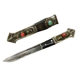 Tibetan small dagger, the 9cm steel blade with horn and brass grip set with a red stone, and matching stylised fish scabbard L19cm overall