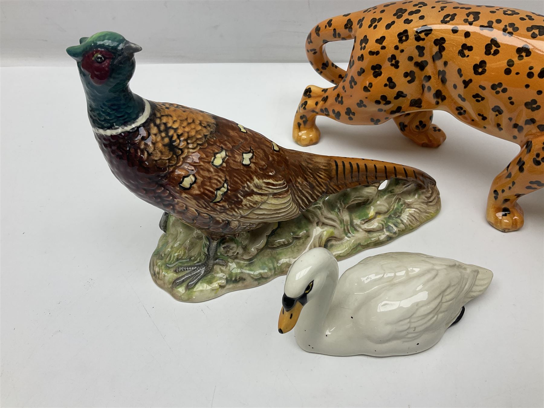 Group of Beswick figures to include leopard no 1082, rabbits, swan, pheasant no 1226 etc, all with marks beneath