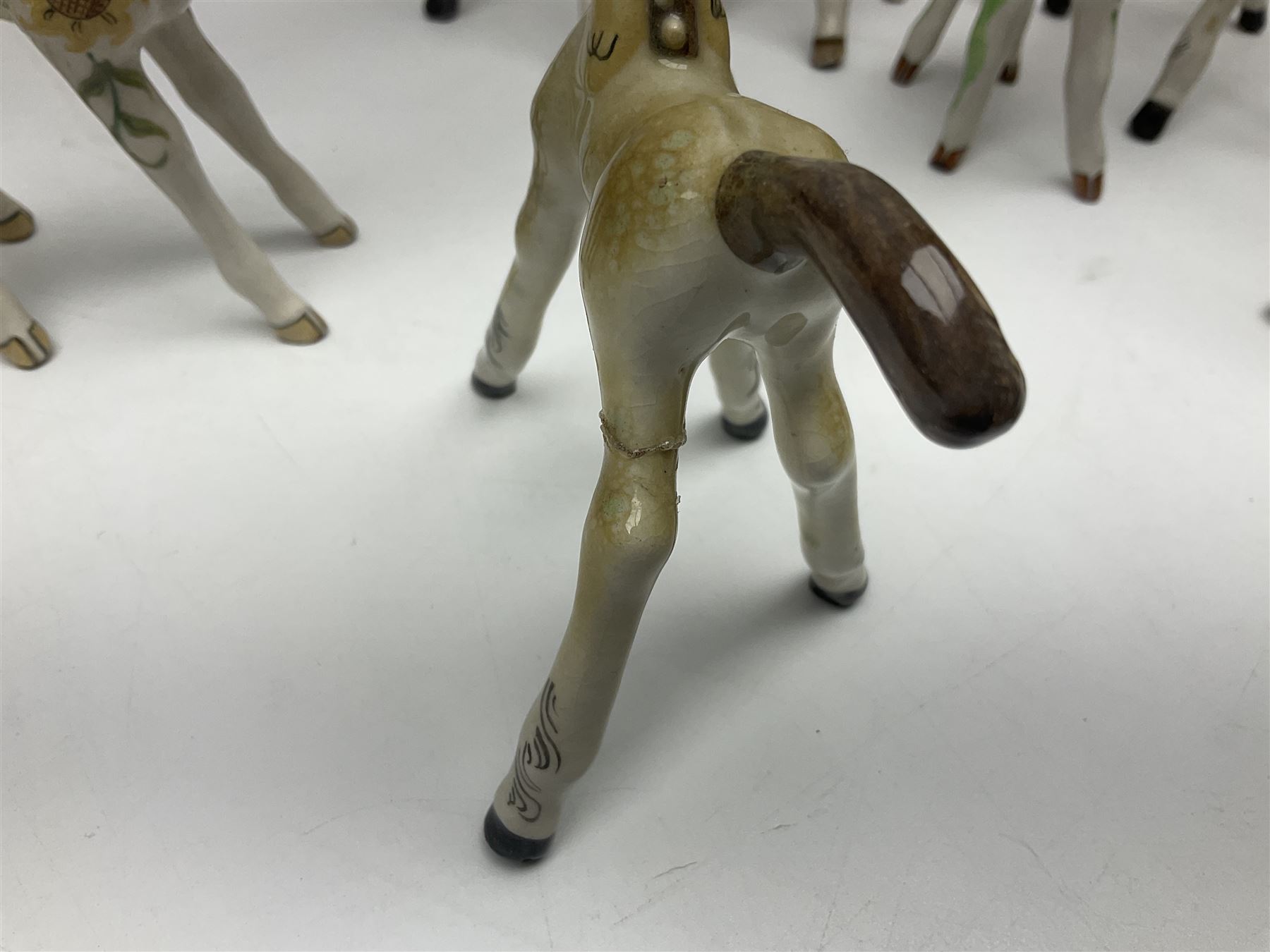 Basil Matthews figures, comprising horses, deer and fawns, all with painted mark beneath, largest H14cm