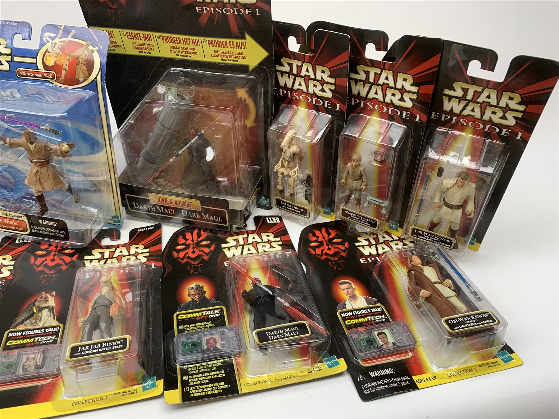 Star Wars - Episode 1 eleven Hasbro action figures, ten with CommTech chip, including two x Obi-Wan Kenobi, Battle Droid, Anakin Skywalker, four x Darth Maul (one Deluxe), Jar Jar Binks and two x Qui-Gon Jinn; together with five Attack of the Clones figures including Obi-Wan Kenobi, Count Dooku, Kit Fisto, Jango Fett and Mace Windu; and an Empire Strikes Back figure of Darth Vader; all in unopened blister packs (17)
