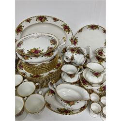 Extensive Royal Albert Old Country Roses pattern tea and dinner service, comprising twelve dinner plates, ten smaller plates, sixteen tea plates, ten saucers, eleven teacups, six bowls, lidded tureen, large oval serving platter, two cake plates, four cake stands including two two tier examples, teapot, two sucriers, two jugs, six mugs, three saucers, sauce boat and saucer, salt and pepper shakers, four tiles in frame and six egg cups
