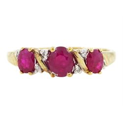 9ct gold ruby and diamond ring, three oval cut rubies spaced by six accent diamonds, stamped 9k