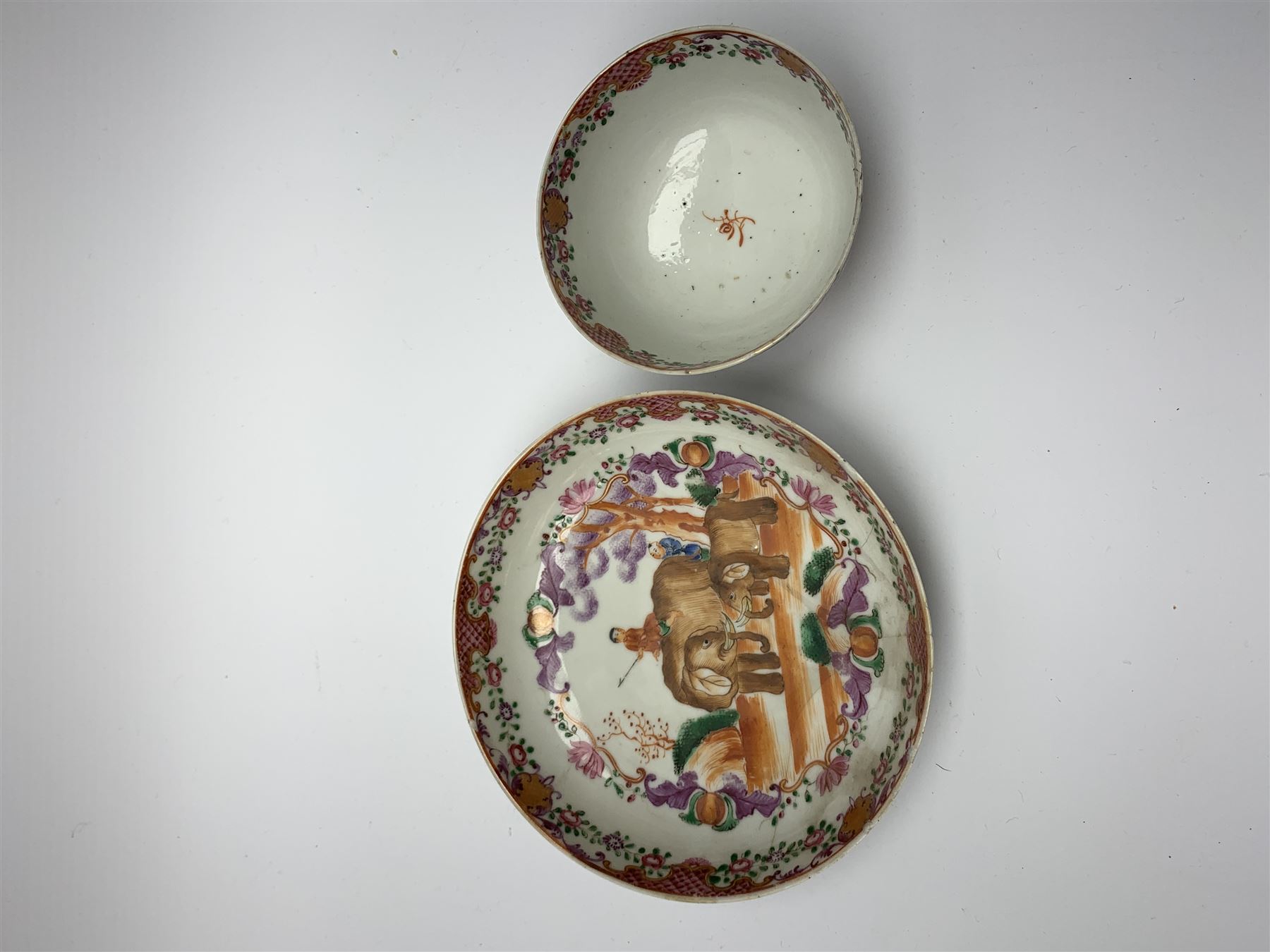 18th Century Chinese export tea bowl and saucer, decorated in the Famille Rose pallet with figures and elephants, tea bowl D8.5cm, saucer D13.5cm