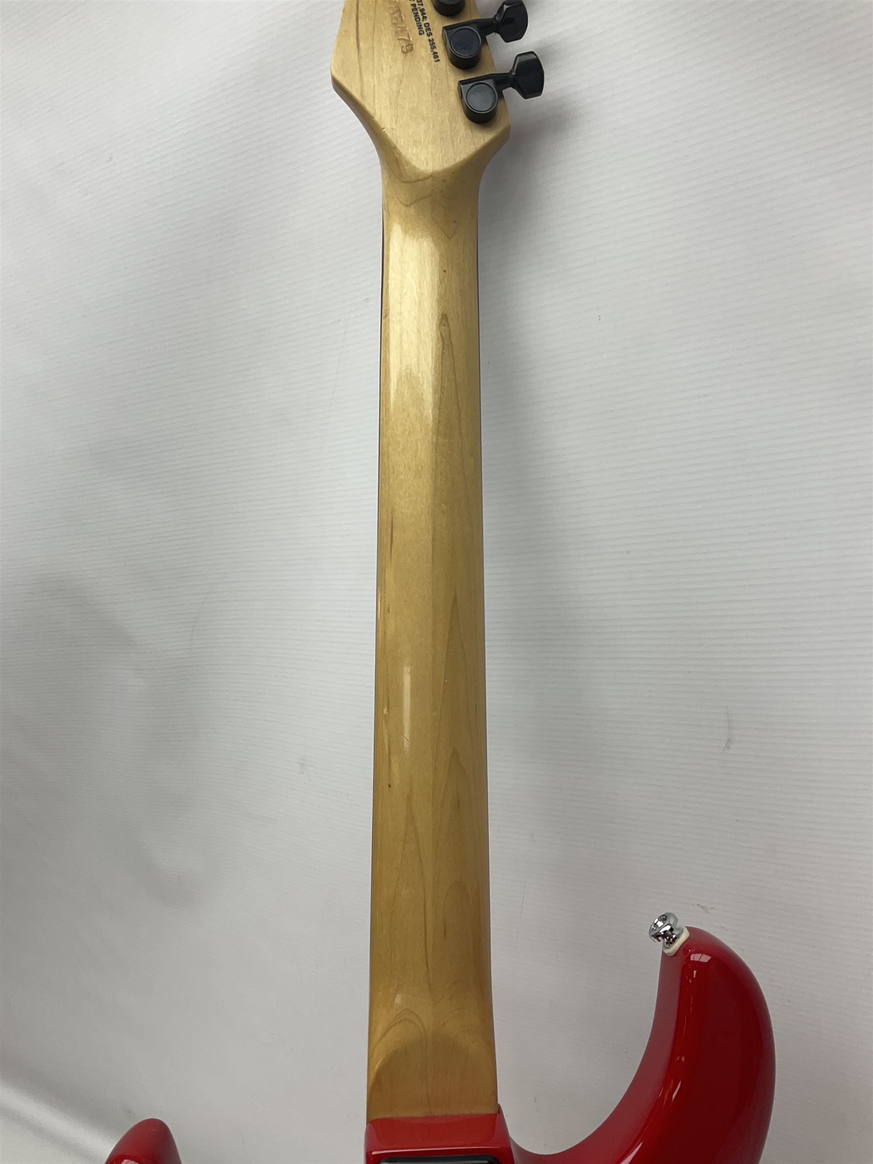 American Peavey Nitro 1 hand-made electric guitar in red with Kahler tremolo, serial no.02786479, L98cm overall; in soft carrying case.