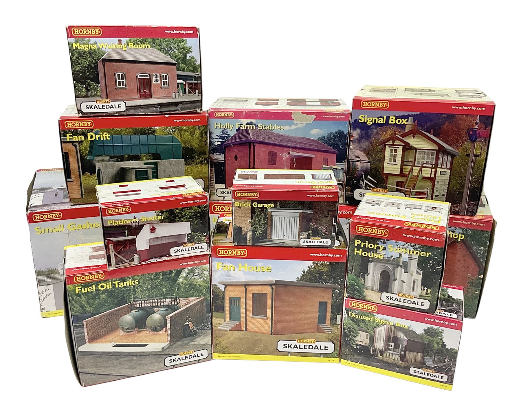 Hornby '00' gauge - thirteen Skaledale trackside buildings/accessories including R8737 Small Gasholder, R9653 Baptist Church, R8542 Holly Farm Workshop, R8534 Signal Box, R8854 Fan Drift, R8525 Holly Farm Stables, R9531 Magna Waiting Room, R8778 Fan House, R8709 Fuel oil Tanks etc; all boxed (13)