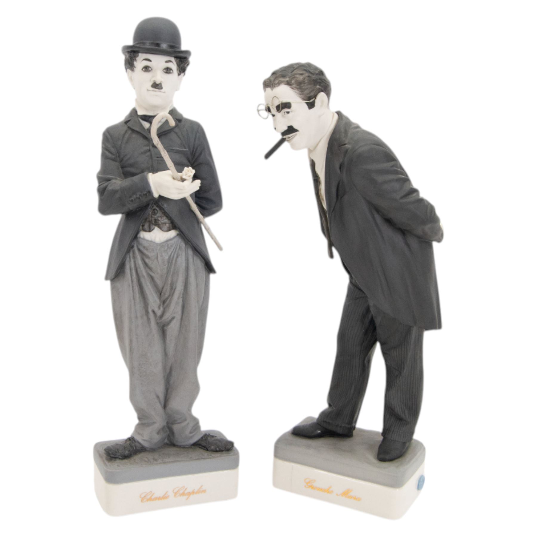 Two Spanish Algora Personajes Del Cine figures, modelled as Charlie Chaplin and Groucho Marx, with printed marks beneath, both with certificates of authenticity, H35cm