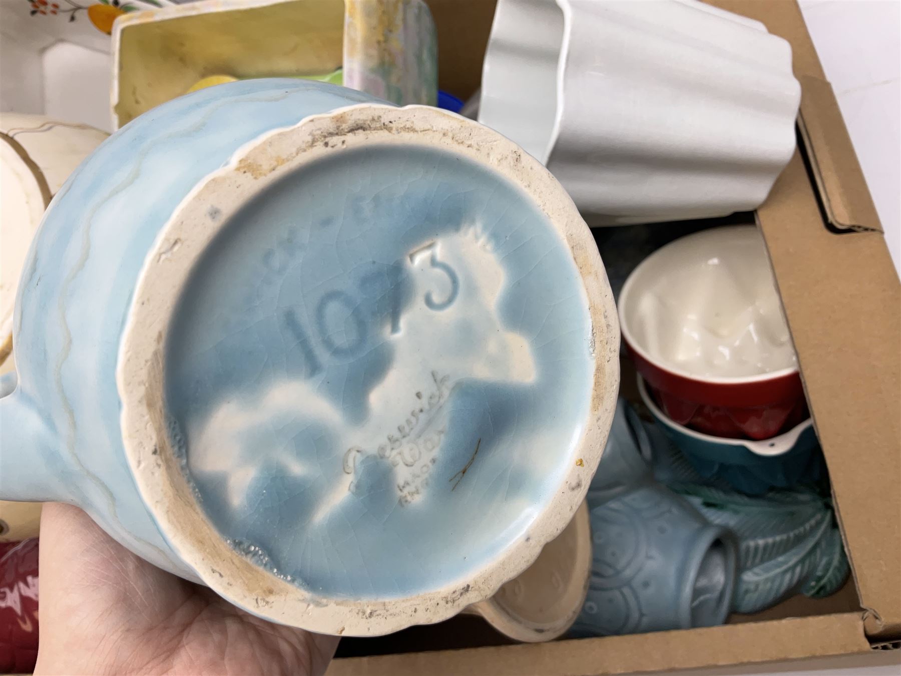 Two Beswick jugs decorated with palm trees, together with matching wall pockets, and similar ceramics, together with six Shelley dishes  