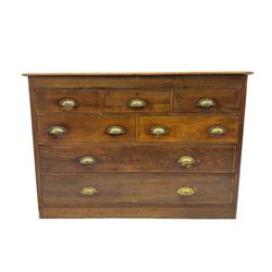 19th century stained beech and pine chest, fitted with seven drawers, ornate cast brass cup handles