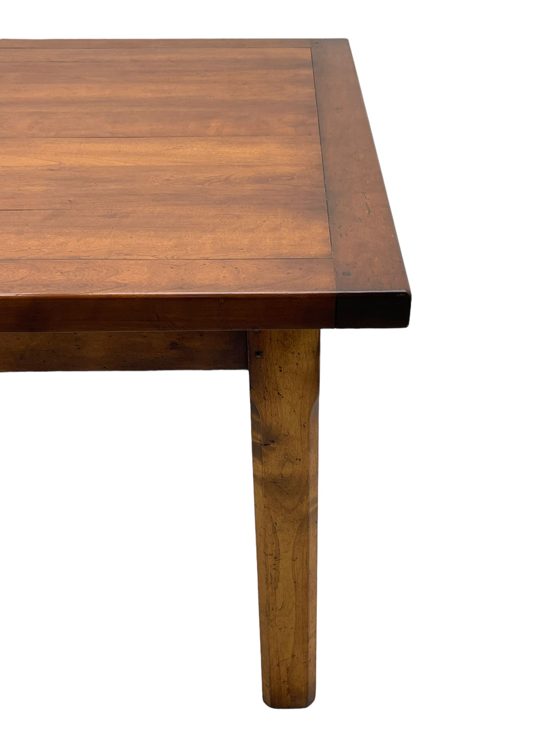 Contemporary French farmhouse design cherry wood dining table, rectangular bordered top on square chamfered supports 