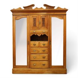 Edwardian walnut triple combination wardrobe, projecting pediment with pierced foliate scr...