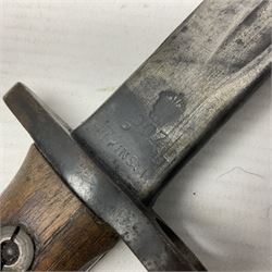WWI British 1907 pattern bayonet, the 43cm fullered blade by Wilkinson with various marks to the ricasso; in leather covered scabbard numbered 294 to the throat and stamped M/58 L58.5cm overall