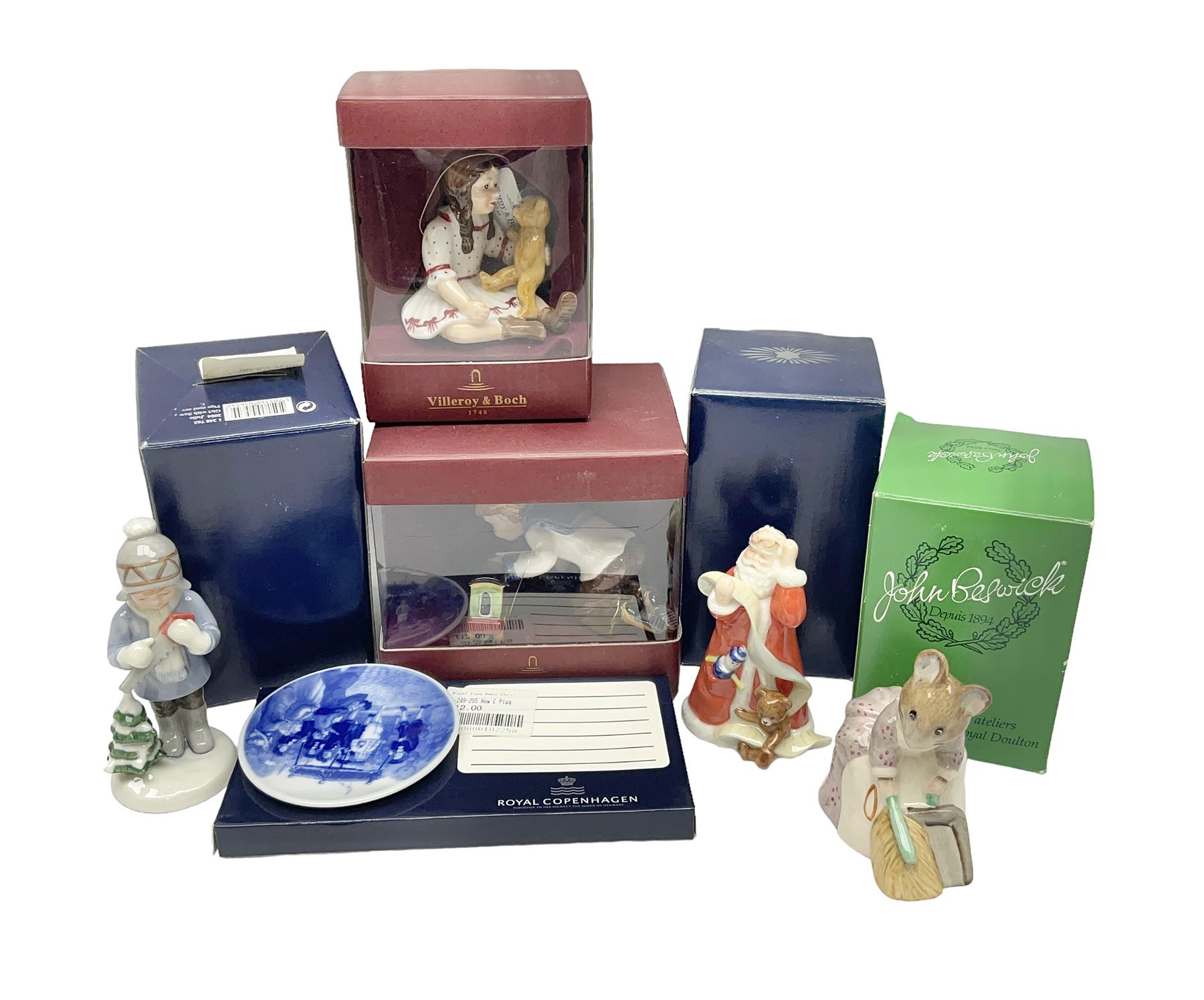 Two Royal Copenhagen figures, comprising Julie and Girl with Saw, together with Beswick Hunca Munca Sweeping, and two Villeroy & Boch christmas decorations, all with original boxes   