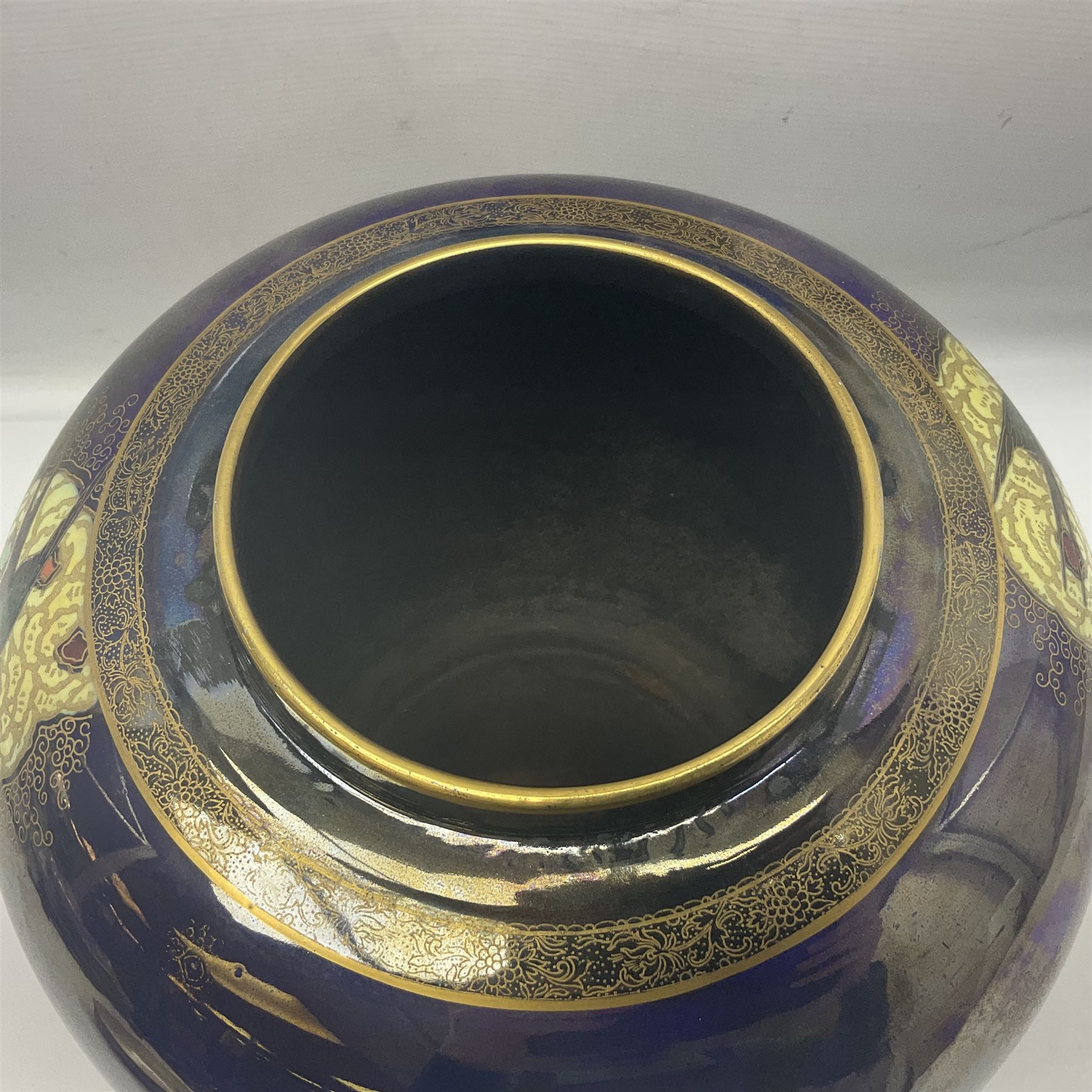 Carlton Ware lustre ginger jar and cover decorated with birds in flight on a blue ground, H32cm