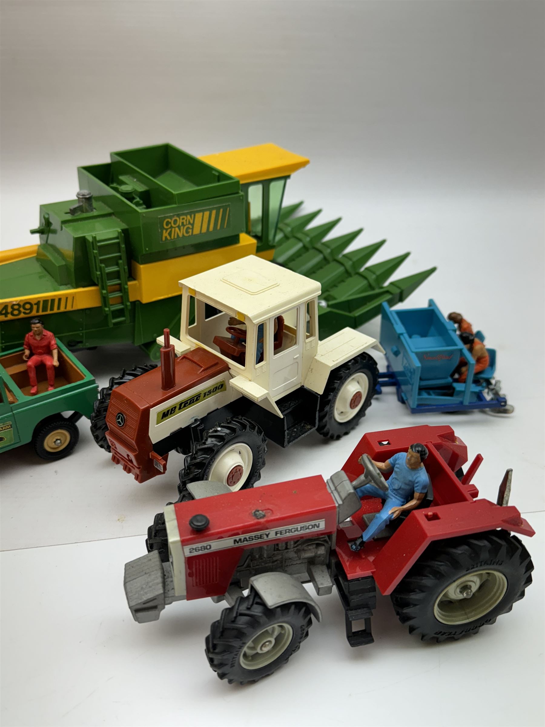 Collection of predominantly late 1970s/early 1980s Britains diecast vehicles and farming equipment, including Corn King, tractors, JCBs, horsebox, skip lorry, etc together with figures and accessories