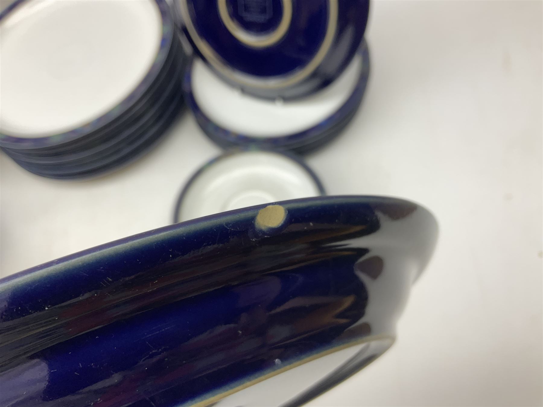 Denby Baroque pattern part tea and dinner service, comprising nine dinner plates, six side plates, six bowls five dessert plates, six cups and saucers, together with a Denby teapot and jug in Imperial blue pattern