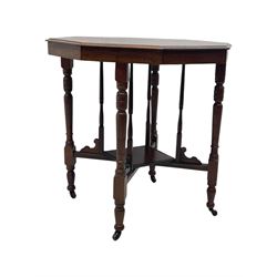 Victorian oak occasional table, octagonal top with bevelled edges, lower section fitted with a square undertier united by decorative shaped stretchers, on turned supports with castors