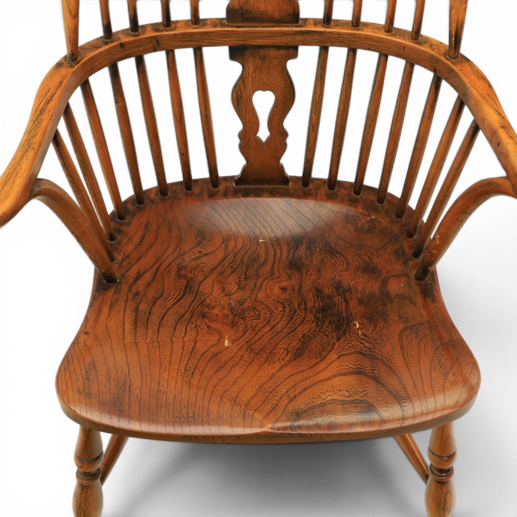 Pair of high back Windsor armchairs, fleur de lis back splat, dished seat, caroline stretcher