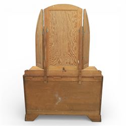 Early 20th century Art Deco bedroom suite, comprising double wardrobe, dressing table and chest of drawers, constructed in walnut with figured veneers and geometric banding, the wardrobe with arched top and panelled doors enclosing a fitted interior, the dressing table with rectangular top below a three panel mirror arrangement, fitted with two short over two long drawers, the chest with three short and three long drawers, each piece fitted with faceted handles and raised on shaped feet
Wardrobe (H 177cm, D 46cm, W 112cm)
Chest (H 85cm, D 48cm, W 92cm)
Dressing table (H 160cm, D 52cm, W 106cm)
