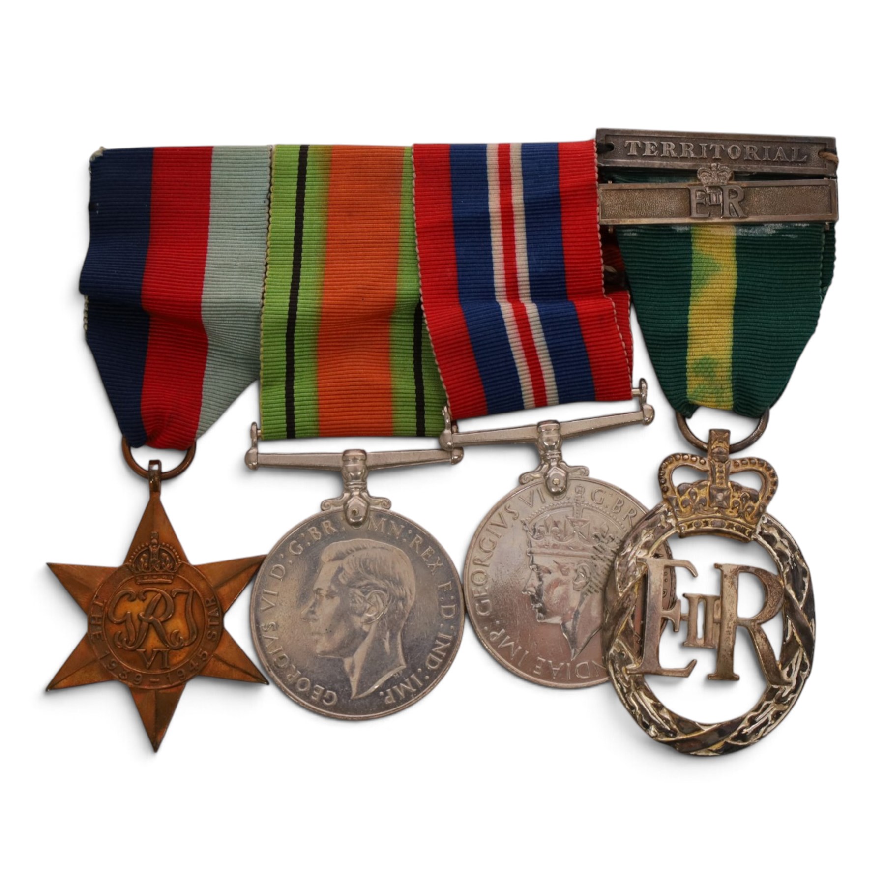 WWII British medal group comprising War medal, Defence medal and 1939-1945 star, together with EII Efficiency Decoration with Territorial bar, with 1955 engraved to reverse 