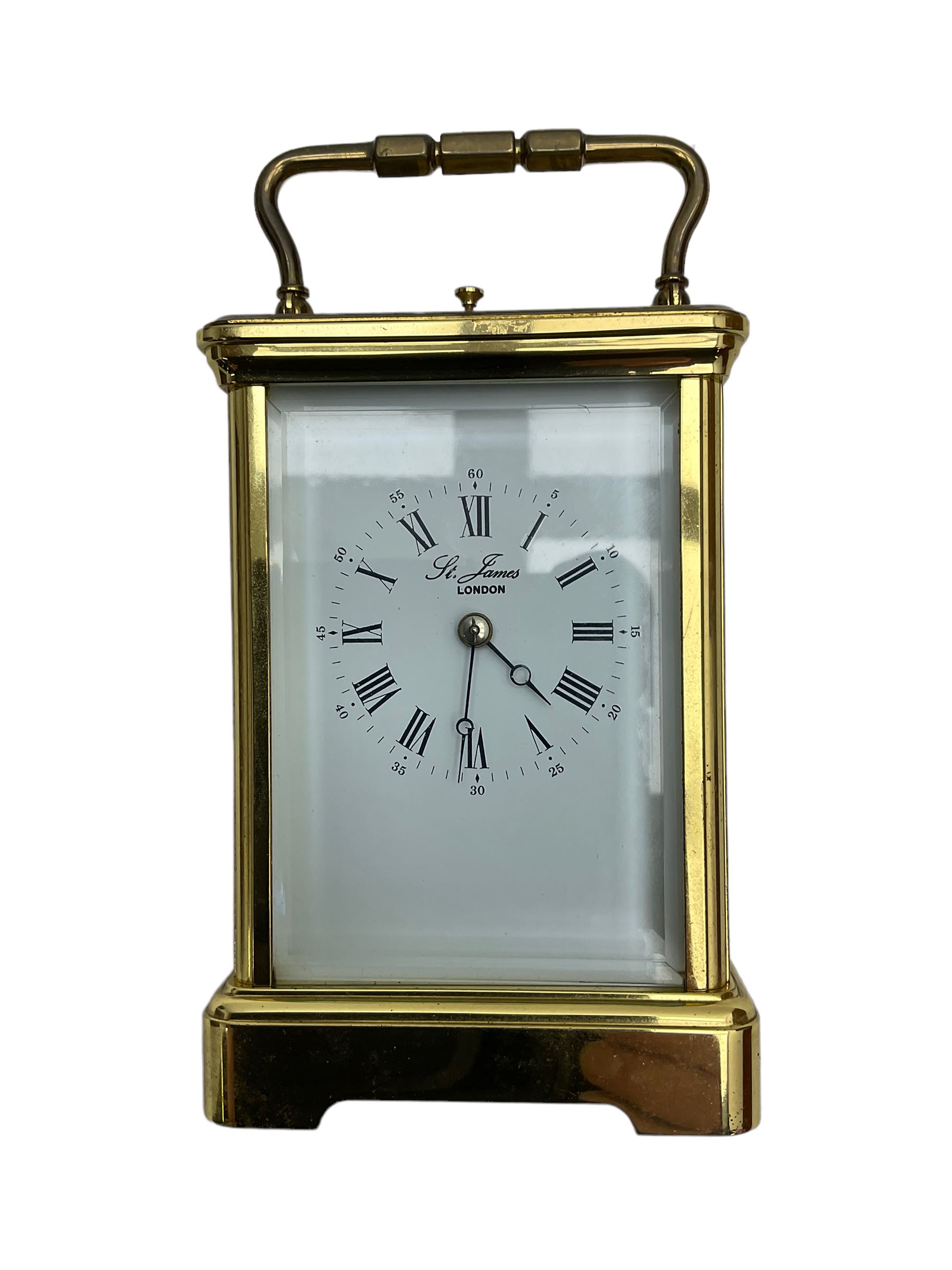 8-day French 20th century corniche carriage clock with a striking movement and repeat work, white enamel dial with Roman numerals, minute track and steel moon hands, dial inscribed St James, London. With a jewelled lever escapement, striking the hours and half hours on a coiled gong. 
