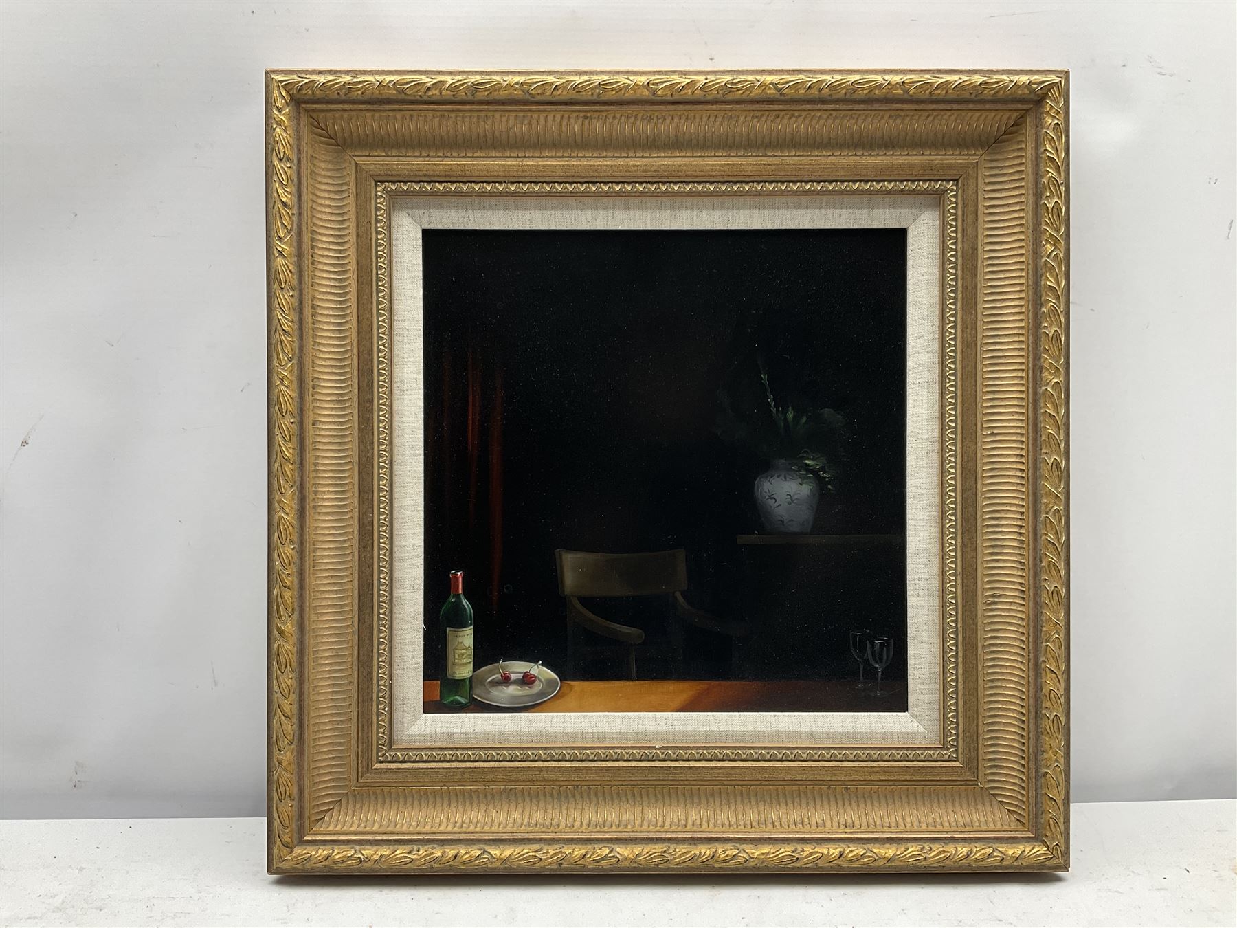 Rachel Robb (Australian 1969-): Cherries on Plate with Wine Bottle, oil on panel, signed verso c.1990, 30.5cm X 30.5cm 
Notes: Rachael was born in Warrnambool, Australia. In 1990, after studying Fine Art at the School of Art, RMIT University  Melbourne, she travelled extensively throughout the world living for a number of years in San Francisco and Prague before settling in London, returning to her home country in 2020