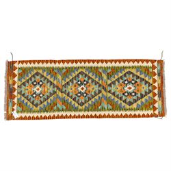 Two Chobi flatweave kilim runners with a repeating stepped diamond medallion design in live green, rust, teal, purple, and ivory, framed by chevron and geometric borders, (2)