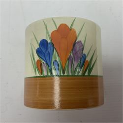 Clarice Cliff for Newport Pottery ceramics, comprising preserve jar and Bon Jour shape teacup, both in Crocus pattern, together with a Clarice Cliff for Wilkinson Ltd, preserve jar with cover, in Gayday pattern, preserve jar H10cm