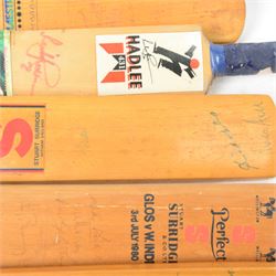 Signed International cricket memorabilia, comprising Alan Donald signed Kookaburra Commander cricket ball, wide brimmed hat signed by Darren Sammy and other West Indies players and a collection of signed miniature cricket bats, each with signatures of International cricket players including Brian Lara, Grant Flower, Richard Hadlee, Zimbabwe vs Rest of World 1993, South Africa vs Presidents VI 1994, Eastern Province South Africa 1992 and South Africa Touring Side Scarborough 1994