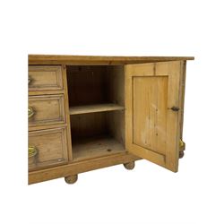 19th century stripped pine dresser base, fitted with six drawers and centre cupboard