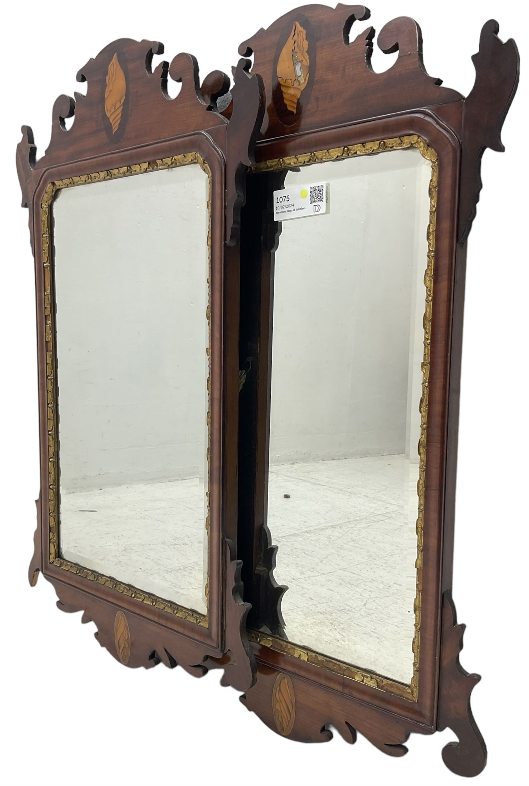 Pair of early 20th century Georgian Chippendale mahogany design wall mirrors, shaped pediment and terminal with shell motif inlays, rectangular bevelled plate within a foliate carved gilt slip