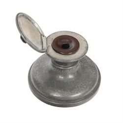 Liberty Tudric pewter ink well, the hinged lid opening to reveal original bakelite liner, stamped marks to base Tudric English Pewter Liberty & Co 01135
