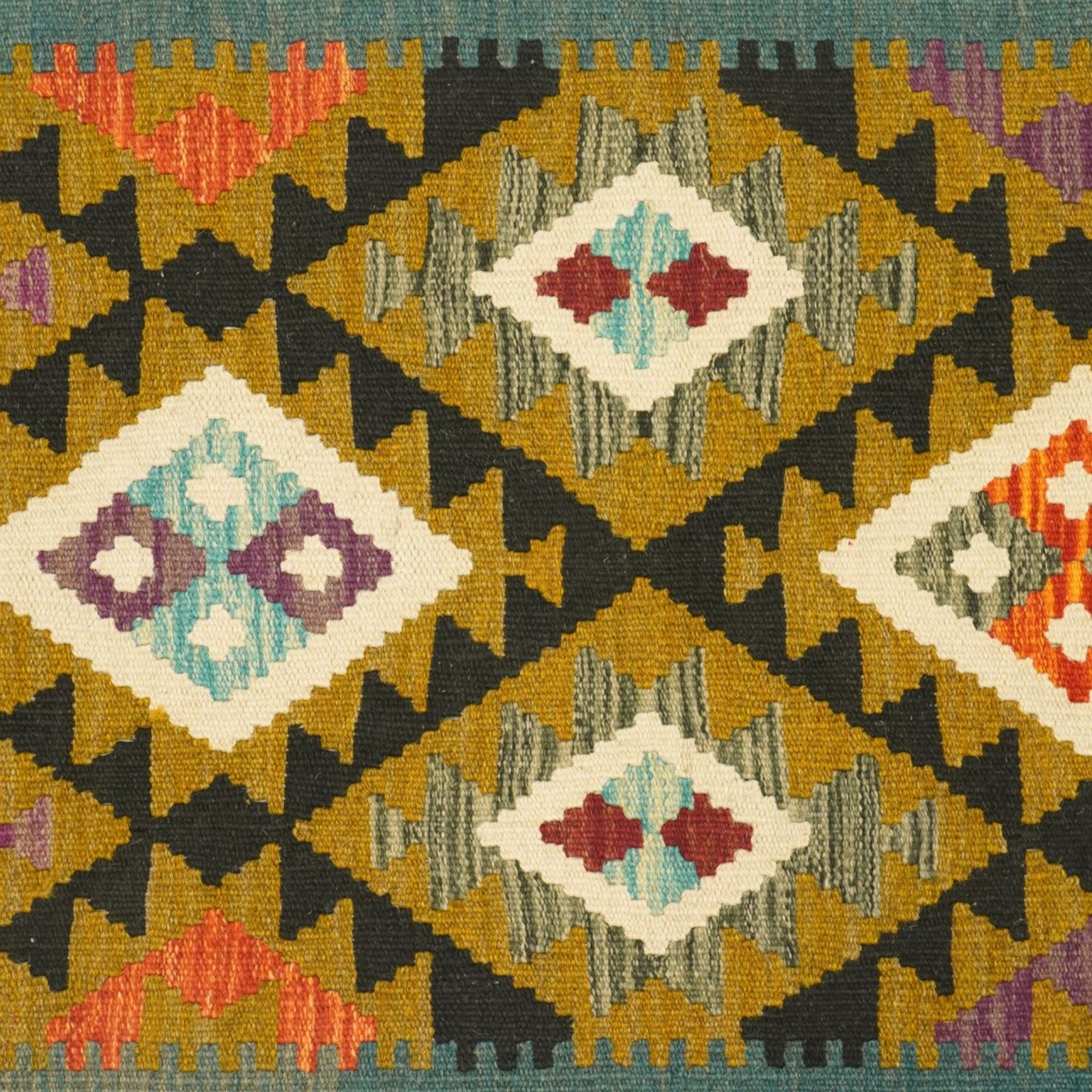 Afghan Maimana flatweave kilim runner, central field features large bold nested diamond motifs and stylized geometric lozenge patterns on olive purple, blue, and green tone ground, dark green border stripe, with fringe ends