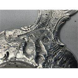 Continental white metal strainer, of shaped form embossed with classical figures, putto, musical trophies and fruiting vines, indistinctly marked, L12.5cm