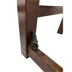 'Gnomeman' set of three oak dining chairs, panelled backs over curved seat rails with drop in rope rush seats, turned front supports with collar joined by plain stretchers, two with carved seated gnome figures, painted

Provenance - This collection of early 'Gnomeman' furniture comes to us directly from the Whittaker family. The pieces were made by the vendor's father Thomas Whittaker in the 1930/40s for his own use. During this time, he lived in York and made items for himself and friends. Whittaker adopted the gnome as a signature and trademark after his move to Littlebeck, Whitby.
