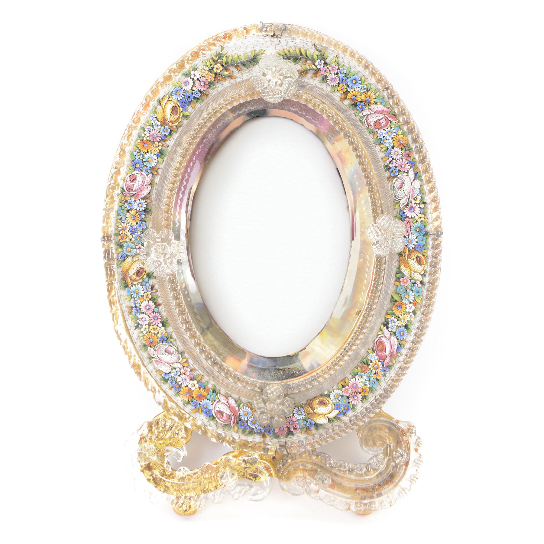 Late 19th/early 20th century Italian micro mosaic mirror decorated with flower heads amongst trailing leaves, applied with blown glass twisted borders, scrolls and flowerheads, upon a gilt wooden frame, H30cm
