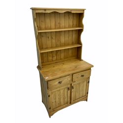 Pine dresser, two heights plate rack, above two short drawers and two cupboard doors