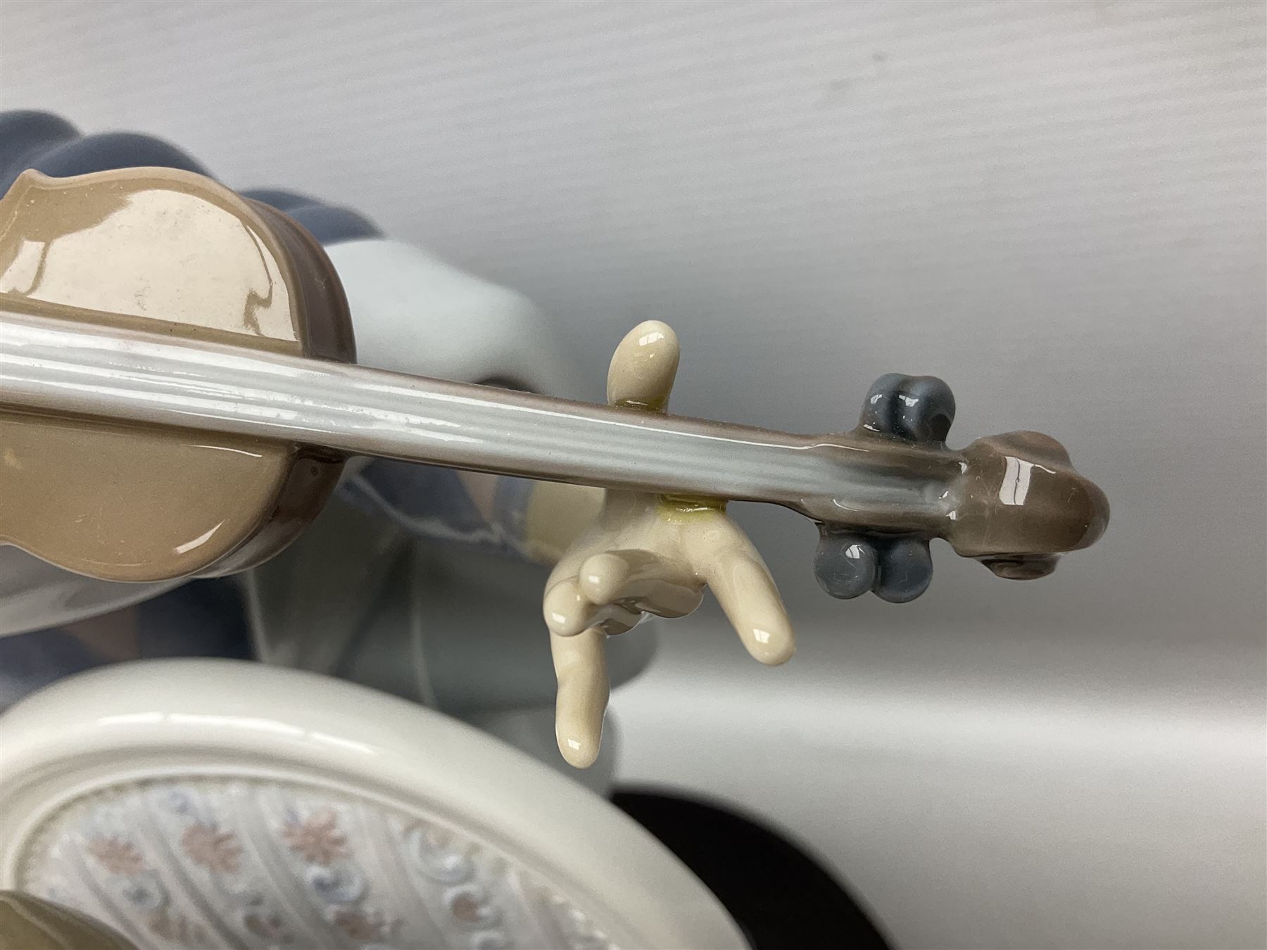 Lladro figure, Jester Serenade, modelled as a ballerina with bouquet of flowers seated before a jester playing the violin, limited edition 2541/3000, sculpted by Antonio Ramos, no 5932, with original box, year issued 1993, year retired 1994, H37cm