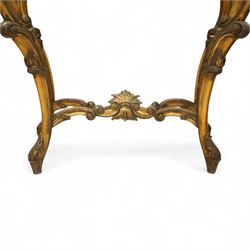 20th century Louis XV design giltwood console table, shaped white marble top over pierced and carved frieze with floral and foliate motifs, raised on cabriole supports united by X-shaped stretcher with central floral finial 