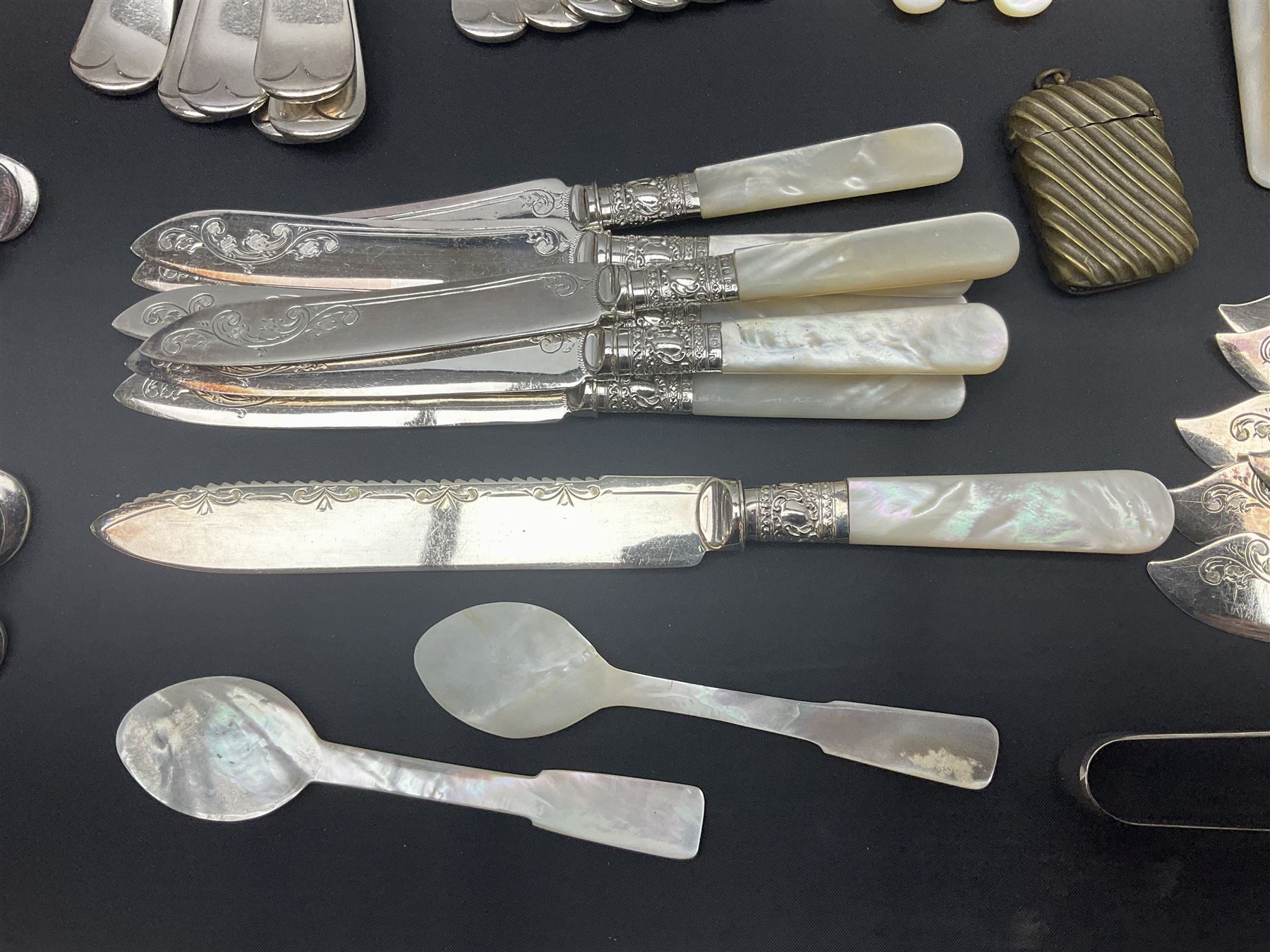 Mother of Pearl handled cutlery, with silver ferrules, comprising six fish knives and forks and six fruit knives and forks, the ferrules hallmarked Yates Brothers, Sheffield 1905, together with silver plated Edwardian three piece tea service and other flatware 