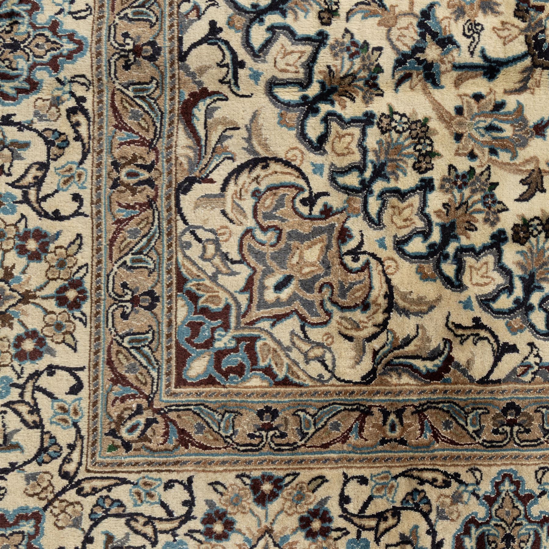 Persian Nain carpet, ivory field with concentric medallion in shades of blue and beige, surrounded by scrolling vines, palmettes and floral sprays, enclosed by multiple borders with intricate foliate motifs, originating from the Nain region of central Iran