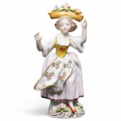 Group of Sitzendorf porcelain figures, one modelled as two children with birds and lambs, the others holding and offering flowers, each upon gilt detailed base, with painted marks beneath (4)