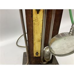 Industrial style table lamp, repurposed from a Griffin & Tatlock measuring apparatus with glass instruments fixed to a wood base, with magnifying glass, H45cm, and a Metal Corinthian column table lamp, H47cm