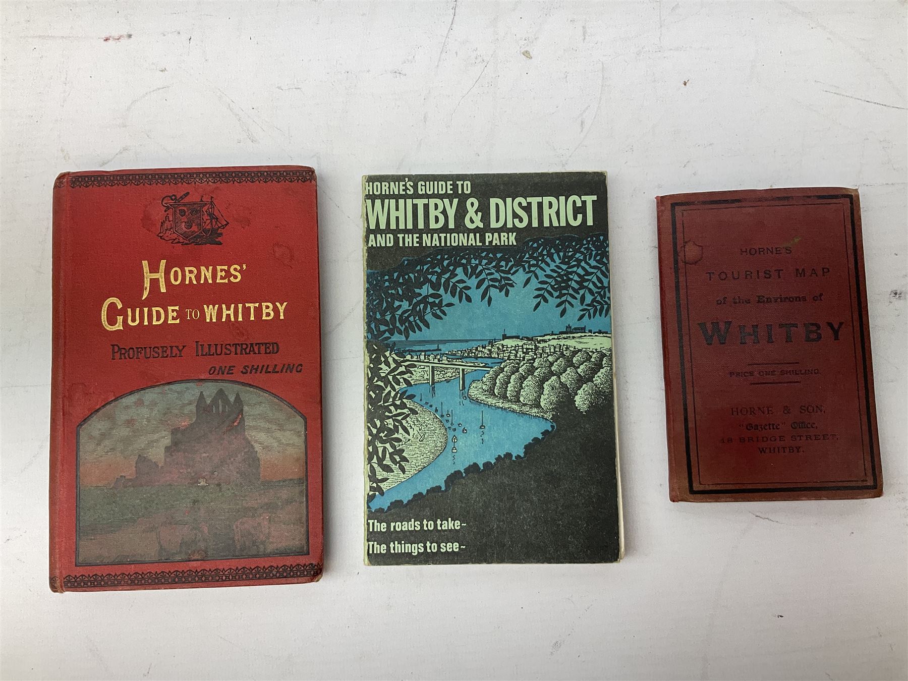 Quantity of books and postcards predominantly of Whitby interest including Hornes' Guide to Whitby 1890 and Hornes' Tourist map of Whitby, A Holiday Tour in and Around Whitby by H.S. Forman 1896 etc