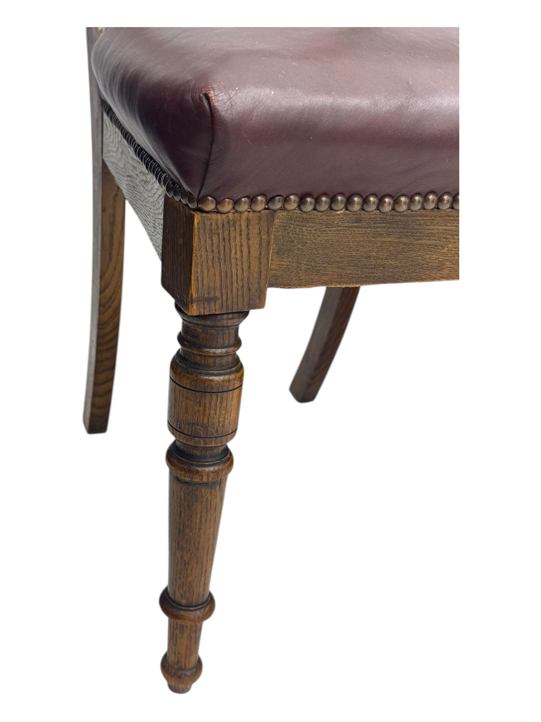Late 19th century elm hall chair, curved backrest with leather upholstered seat, on turned supports (H81cm, W51cm), early 20th century mahogany commode, hinged lid opening to ceramic liner (H44cm, W47cm, D44cm), late Victorian upholstered nursing chair in green patterned fabric (H79cm, W49cm)