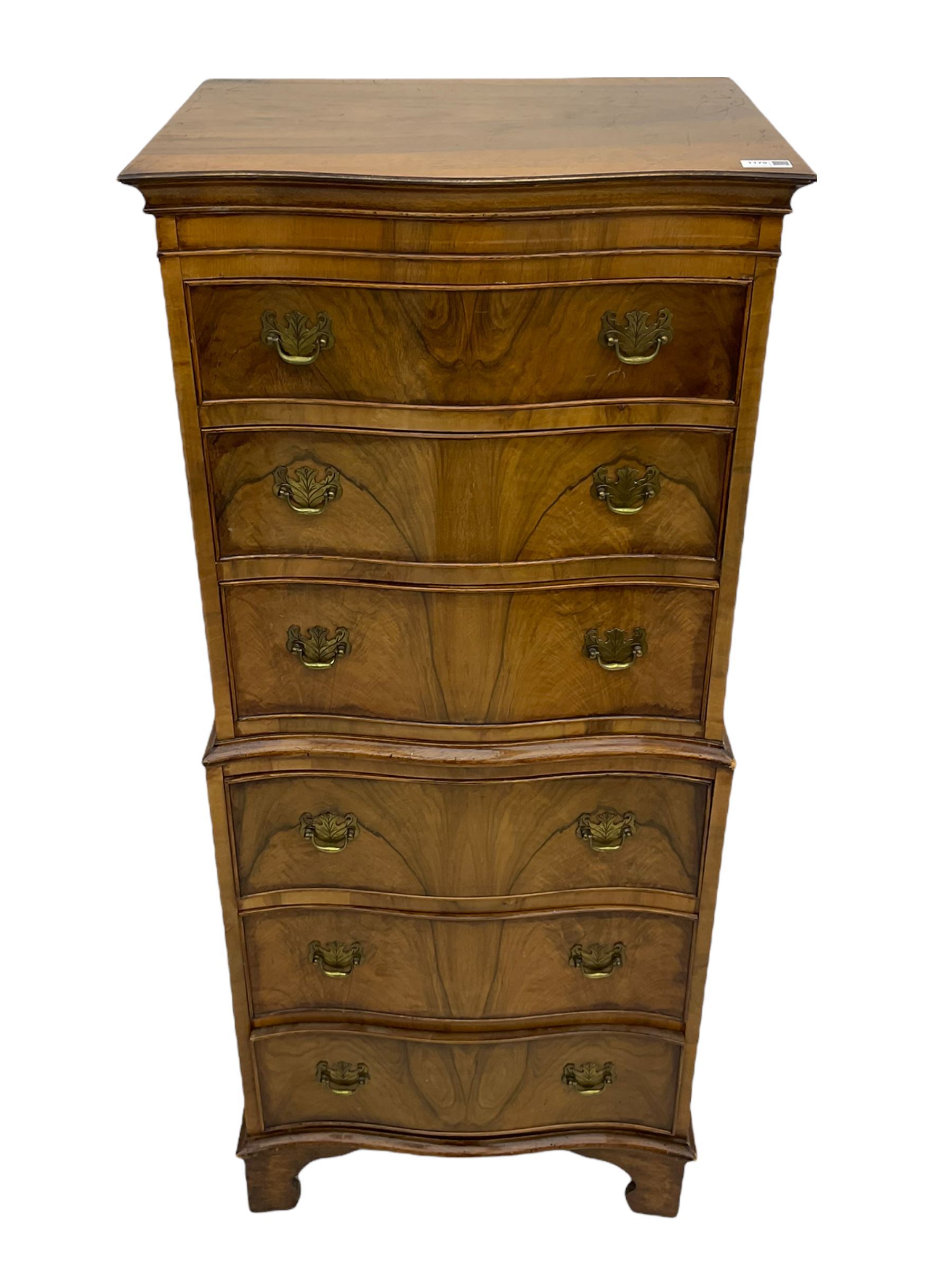 Burton Reproductions walnut chest on chest, fitted with six serpentine drawers