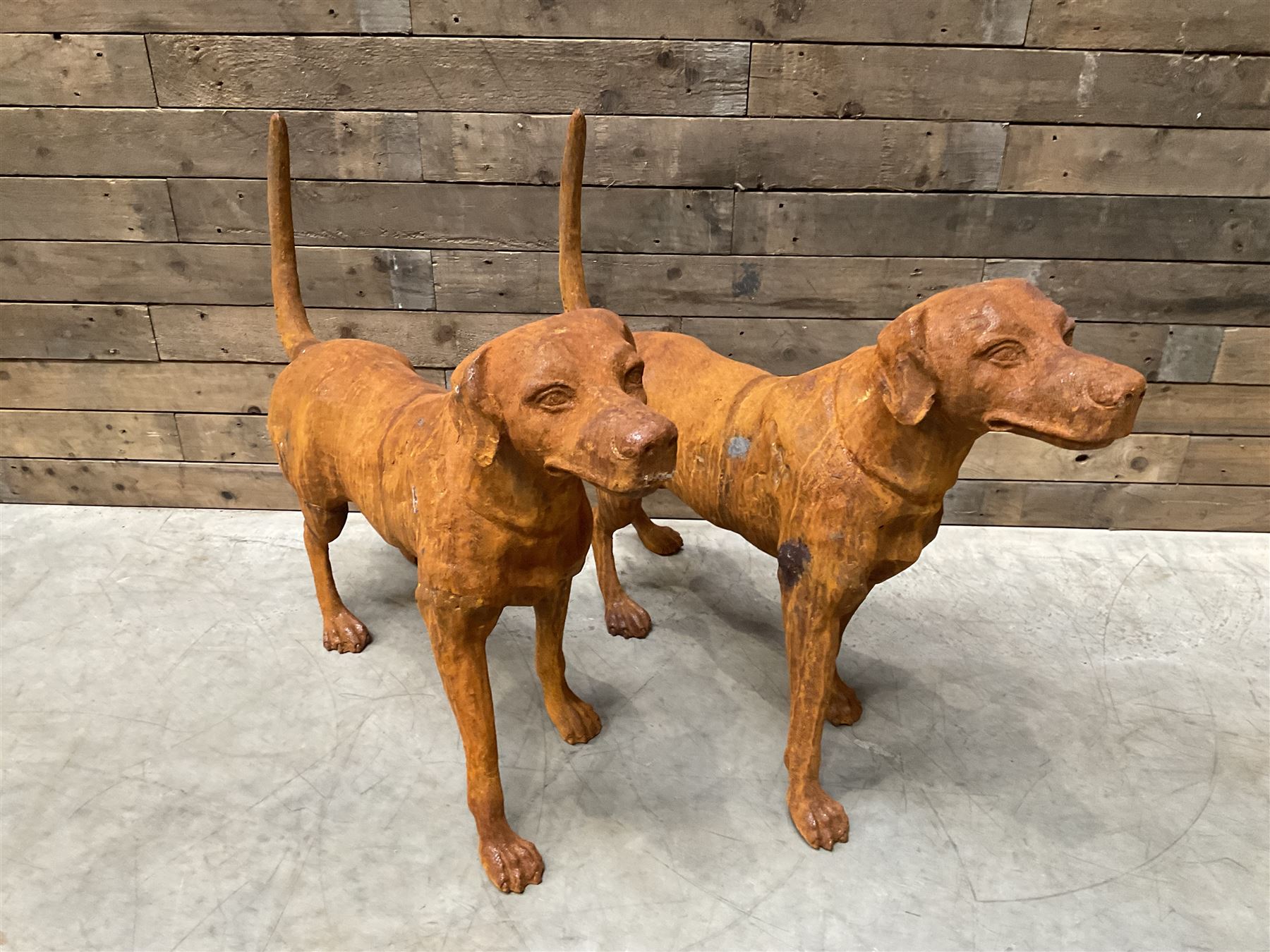 Pair of life-size heavy cast iron garden Hunting dogs