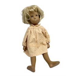 Sasha Morgenthaler vinyl doll, the girl's head with painted blue eyes and lips and short blonde hair, the jointed body donning a peach floral dress with matching underclothes, unmarked, H41cm